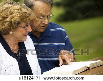 Stock Photography - senior couple 
reading the bible. 
fotosearch - search 
stock photos, 
pictures, images, 
and photo clipart