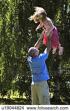 Stock Photo - father being playful 
with daughter. 
fotosearch - search 
stock photos, 
pictures, images, 
and photo clipart