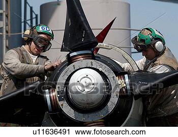 Stock Photography - two us navy aviation 
machinist's perform 
maintenance on 
a propeller. fotosearch 
- search stock 
photos, pictures, 
images, and photo 
clipart
