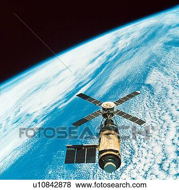 Stock Photo - spacecraft over 
earth. fotosearch 
- search stock 
photos, pictures, 
images, and photo 
clipart