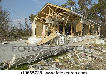 Stock Photo - debris in front 
of house heavily 
hit by hurricane 
ivan. fotosearch 
- search stock 
photos, pictures, 
images, and photo 
clipart