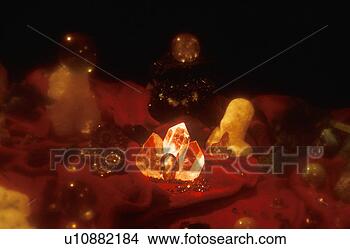 Stock Photo - an assortment 
of precious jewels 
and glowing crystal 
rock formations. 
fotosearch - search 
stock photos, 
pictures, images, 
and photo clipart