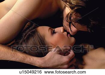 Stock Photo - black background, 
close-up, brown 
hair, adults only. 
fotosearch - search 
stock photos, 
pictures, wall 
murals, images, 
and photo clipart