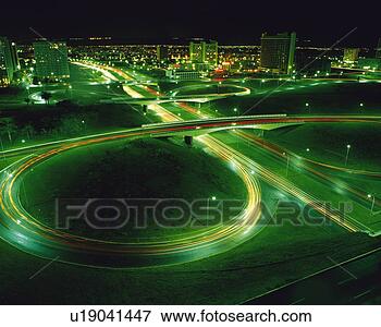 Picture - a highway with 
multi-lanes and 
several curves 
at night,  surrounded. 
fotosearch - search 
stock photos, 
pictures, images, 
and photo clipart
