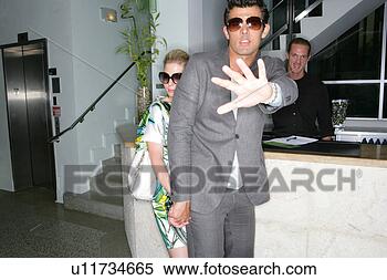 Stock Image - celebrity couple 
in hotel lobby. 
fotosearch - search 
stock photos, 
pictures, images, 
and photo clipart