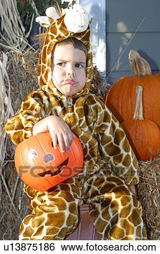 Stock Photo - caucasian boy 
wearing a giraffe 
costume and frowning 
on halloween. 
fotosearch - search 
stock photos, 
pictures, images, 
and photo clipart