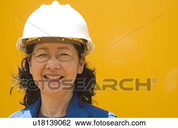 Stock Photo - baby boomer woman 
in hard hat. fotosearch 
- search stock 
photos, pictures, 
images, and photo 
clipart