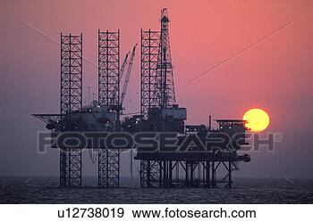 Stock Photograph - ocean oil rig 
at sunset. fotosearch 
- search stock 
photos, pictures, 
images, and photo 
clipart