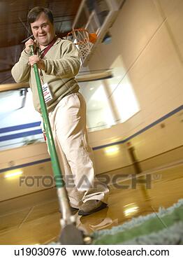 Stock Photo - man with down 
syndrome sweeping 
a gymnasium floor 
and smiling. fotosearch 
- search stock 
photos, pictures, 
images, and photo 
clipart