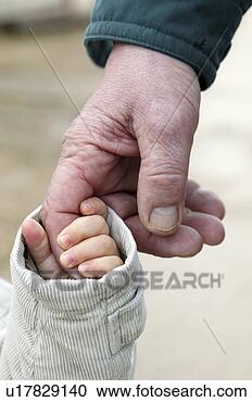 Stock Photography - little hand holding 
big old hand. 
fotosearch - search 
stock photos, 
pictures, images, 
and photo clipart
