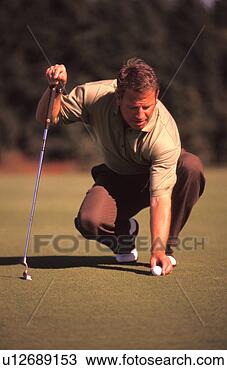 Stock Photo - man putting on 
golf green. fotosearch 
- search stock 
photos, pictures, 
images, and photo 
clipart