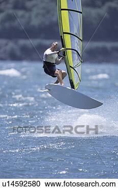 Stock Photography - windsurfer aloft. 
fotosearch - search 
stock photos, 
pictures, images, 
and photo clipart