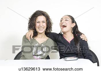 Stock Photo - portrait of two 
young women with 
their arms around 
each other. fotosearch 
- search stock 
photos, pictures, 
images, and photo 
clipart