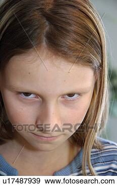 Stock Photograph - glowering young 
girl. fotosearch 
- search stock 
photos, pictures, 
images, and photo 
clipart