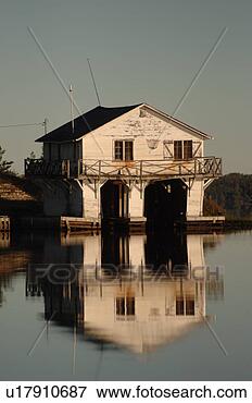 Picture - boathouse at shoreline 
of lake. fotosearch 
- search stock 
photos, pictures, 
images, and photo 
clipart