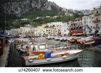 Picture - boats along dock 
with coastal buildings 
in capri, italy. 
fotosearch - search 
stock photos, 
pictures, images, 
and photo clipart