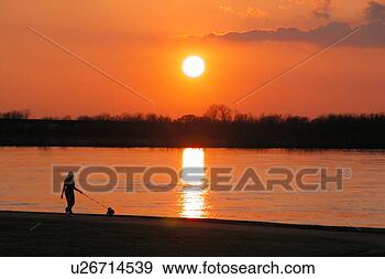 Stock Photograph - the sun sets on 
the mississippi 
river. fotosearch 
- search stock 
photos, pictures, 
images, and photo 
clipart