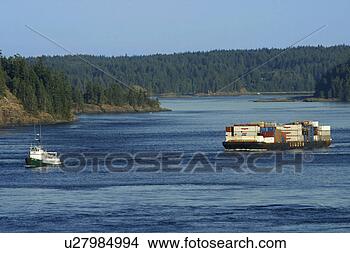 Stock Photo - tug boat pulling 
barge full of 
cargo. fotosearch 
- search stock 
photos, pictures, 
images, and photo 
clipart