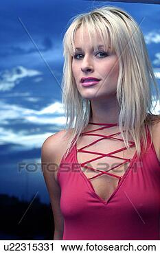 Stock Photography - blonde model in 
pink near blue 
water. fotosearch 
- search stock 
photos, pictures, 
images, and photo 
clipart