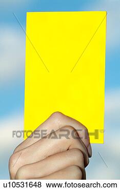 Stock Photo - yellow card in 
the hands of a 
referee. fotosearch 
- search stock 
photos, pictures, 
images, and photo 
clipart