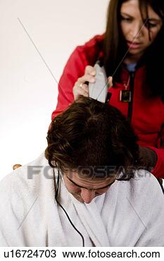 Stock Photo - picture of a man 
getting hair cut 
in his twenties. 
fotosearch - search 
stock photos, 
pictures, images, 
and photo clipart