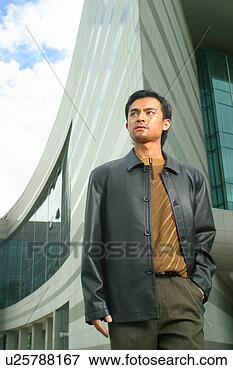 Picture - chinese man in 
a suit in front 
of a building. 
fotosearch - search 
stock photos, 
pictures, images, 
and photo clipart