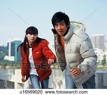 Stock Photography - young asian people 
wearing casual 
and sports clothing. 
fotosearch - search 
stock photos, 
pictures, images, 
and photo clipart