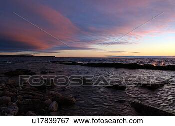 Picture - morning light 
red clouds in 
isthmis bay. fotosearch 
- search stock 
photos, pictures, 
images, and photo 
clipart