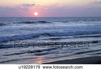 Stock Photograph - sunset on the 
beach. fotosearch 
- search stock 
photos, pictures, 
images, and photo 
clipart