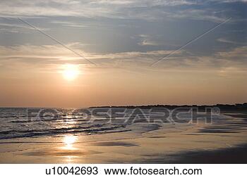 Stock Photo - beach at sunset. 
fotosearch - search 
stock photos, 
pictures, images, 
and photo clipart