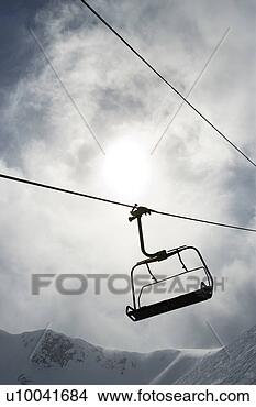 Stock Photo - empty chair lift 
at ski resort. 
fotosearch - search 
stock photos, 
pictures, images, 
and photo clipart