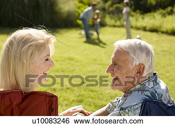 Stock Photo - grandparents and 
family in park. 
fotosearch - search 
stock photos, 
pictures, images, 
and photo clipart