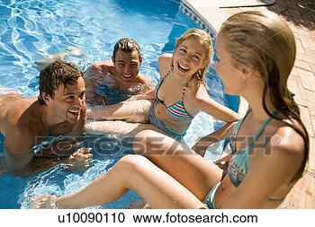 Stock Photography - young couples 
by pool. fotosearch 
- search stock 
photos, pictures, 
images, and photo 
clipart