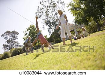 Stock Photo - grandparents and 
family in park. 
fotosearch - search 
stock photos, 
pictures, images, 
and photo clipart