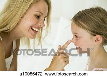 Stock Photo - mother and daughter 
with makeup. fotosearch 
- search stock 
photos, pictures, 
images, and photo 
clipart