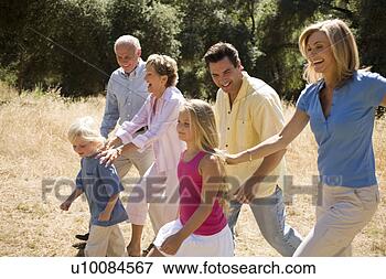 Picture - three generations 
of family walking 
in park. fotosearch 
- search stock 
photos, pictures, 
images, and photo 
clipart