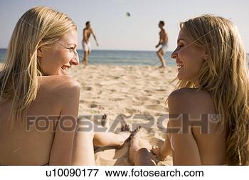 Picture - two couples playing 
on beach. fotosearch 
- search stock 
photos, pictures, 
images, and photo 
clipart