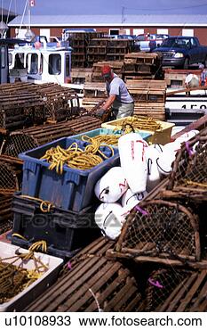 Stock Photo - lobster pots, 
 fishing nets, 
 fishing boat 
and shed,  trocadie 
bay. fotosearch 
- search stock 
photos, pictures, 
images, and photo 
clipart