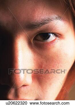 Stock Photography - young adult man 
staring, close 
up, portraint. 
fotosearch - search 
stock photos, 
pictures, images, 
and photo clipart