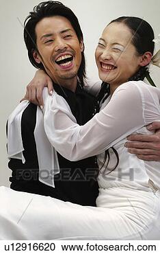 Stock Photography - man in black holding 
woman in white, 
front view, side, 
view. fotosearch 
- search stock 
photos, pictures, 
images, and photo 
clipart