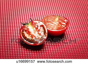 Picture - tomato split into 
two, high angle 
view, copy space. 
fotosearch - search 
stock photos, 
pictures, images, 
and photo clipart