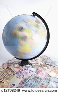 Stock Photograph - high angle view 
of a globe on 
a heap of indian 
banknotes and 
euro. fotosearch 
- search stock 
photos, pictures, 
images, and photo 
clipart
