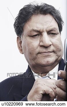 Stock Photograph - close-up of a 
businessman operating 
a mobile phone. 
fotosearch - search 
stock photos, 
pictures, images, 
and photo clipart