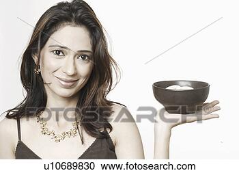 Stock Photography - portrait of a 
young woman holding 
a bowl of food. 
fotosearch - search 
stock photos, 
pictures, images, 
and photo clipart