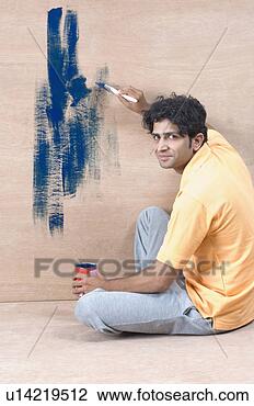 Stock Photo - portrait of a 
young man painting 
a wall. fotosearch 
- search stock 
photos, pictures, 
images, and photo 
clipart
