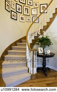 Stock Photo - vignette of curved 
staircase and 
pictures. fotosearch 
- search stock 
photos, pictures, 
images, and photo 
clipart