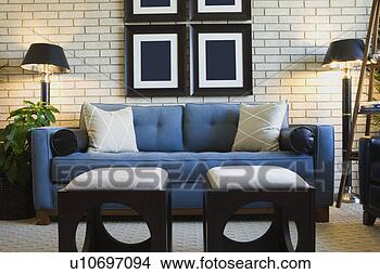 Stock Photo - detail of living 
room couch with 
foot stools. fotosearch 
- search stock 
photos, pictures, 
images, and photo 
clipart