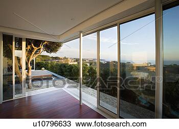 Stock Photo - modern living 
room with sliding 
door. fotosearch 
- search stock 
photos, pictures, 
images, and photo 
clipart