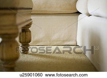 Stock Photography - low perspective 
detail of couch 
and table legs. 
fotosearch - search 
stock photos, 
pictures, images, 
and photo clipart