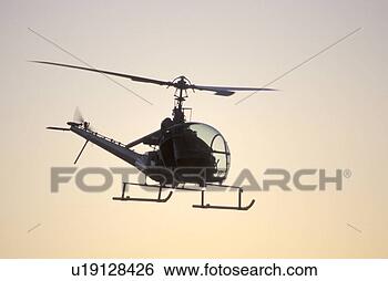 Stock Photo - flying helicopter. 
fotosearch - search 
stock photos, 
pictures, images, 
and photo clipart